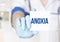 Doctor writing word ANOXIA on card, Medical concept