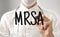 Doctor writing word MRSA with marker, Medical concept