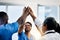 Doctors celebrating medical success after working together as a team and give each other motivating a high five as a