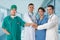 Doctors group, surgeon and nurse on hospital background