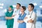 Doctors group, surgeon and nurse on hospital background