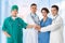 Doctors group, surgeon and nurse on hospital background