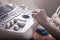 Doctors hands, using an ultrasound scanner, examine the patients organs