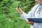 Doctors hold a bottle of hemp oil, researching hemp oil extracts for medical purposes, alternative remedy or medication,medicine