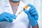 Doctors hold the syringe, vaccine, cure virus, bacteria and in there the yellow chemical liquid for research and analysis in a