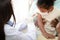 Doctors inject a vaccine in the arm of a young African-American girl to strengthen immunity and protect it from diseases.