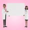 Doctors. Medical specialists man and woman holding blank poster.