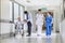 Doctors Nurse senior Female Patient in Hospital Corridor