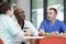 doctors and nurses in hospital rest room taking break