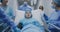 Doctors and paramedics push gurney with sick kid