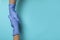 Doctors shake hands in medical gloves on blue background