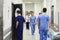 Doctors walking through corridor in hospital