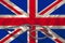 Doctorâ€™s tool, medical stethoscope, lies on the silk national flag of Great Britain state, concept of tourism, insurance, health