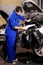 Document, man and mechanic check engine of car, repair and maintenance. Checklist, technician and serious person on