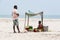 Documentary editorial. DANUSHKODI, PAMBAN ISLAND, TAMIL NADU, INDIA - March circa, 2018. Unidentified woman sell fruits peanuts to