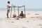 Documentary editorial. DANUSHKODI, PAMBAN ISLAND, TAMIL NADU, INDIA - March circa, 2018. Unidentified woman sell fruits peanuts to