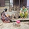 Documentary editorial image.Vendor selling fresh flowers, vegetables, fruits, umbrella for devotees to bless Hindu god Ganesh at l