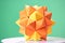 Dodecahedron origami on green background