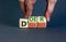 Doer or dreamer symbol. Concept words Doer or dreamer on wooden cubes. Businessman hand. Beautiful grey table grey background.