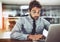 This doesnt look good at all. a handsome young businessman looking stressed out while working on a laptop in an office.