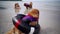 Dog being punished for bad behavior. Golden Retriever relaxing on summer beach