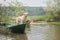 dog in the boat. Labrador Retriever in nature