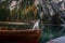 Dog in a boat on a lake. Jack Russell Terrier in nature. Traveling with a pet to Italy, Lago di Braies