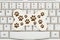 A dog bone with paw prints on a keyboard