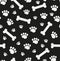 Dog bones seamless pattern. Bone and traces of puppy paws repetitive texture. Doggy endless background. Vector