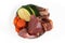Dog bowl filled with mixture of biologically appropriate raw food containing meat chunks and vegetables