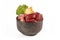 Dog bowl with mixture of biologically appropriate raw food containing meat chunks, fish, fruits and vegetables