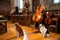 dog and cat musicians rehearsing their parts in a grand hall