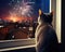 The dog cat is watching fireworks through a window.