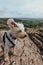 Dog with ears flying in the wind on top of Crook Peak, Mendip Hills, UK