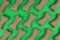 Dog food bones on green background pattern