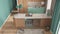 Dog friendly wooden and turquoise kitchen. Dog bed inside furniture with soft pillows and toys, space devoted to pets. Carpet,