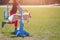 Dog with handler vaulting hurdle in agility trial