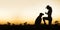 Dog and his trainer - silhouette image with blank, copy space