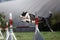 Dog hurdling over a jump at an agility event