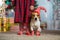 Dog Jack Russell Terrier and legs of a little girl in red white