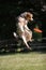 Dog jumps for frisbee disc