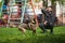 A dog and a man, a German shepherd and a young man walk on a sunny day