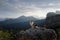 Dog on the mountain at sunset. Travelling with a pet. Australian shepherd in nature