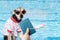 Dog passport, dog with pet document for traveling with animals relaxing in the pool