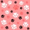 Dog paw. Pink  background and dog tracks. Pattern with traces.