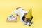 Dog with paw print birthday cake and birthday