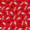 Dog paw seamless pattern for Christmas - paw print, and Santas hat, bone and woof text on red backgound.
