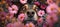 A dog\\\'s face peeks out from the flowers. Close up of a puppy nose in a bouquet of flowers. A pet