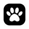 The dog`s track in the black square. cat and dog paw print inside square