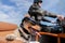 Dog sits with sunglasses in a motorcycle sidecar